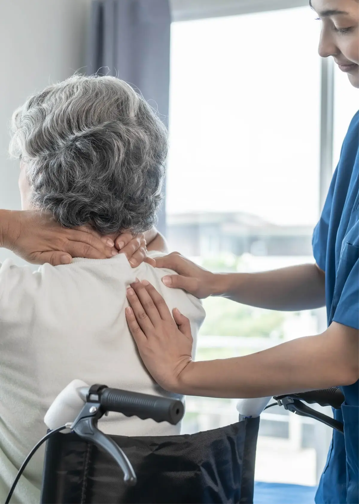 Therapist assisting a patient with neck mobility exercises
